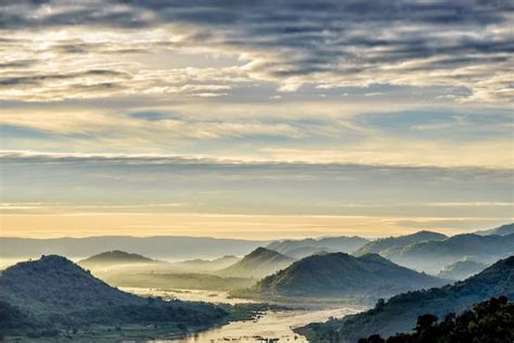 Premium Photo | Misty mountains and rivers on sunrise.