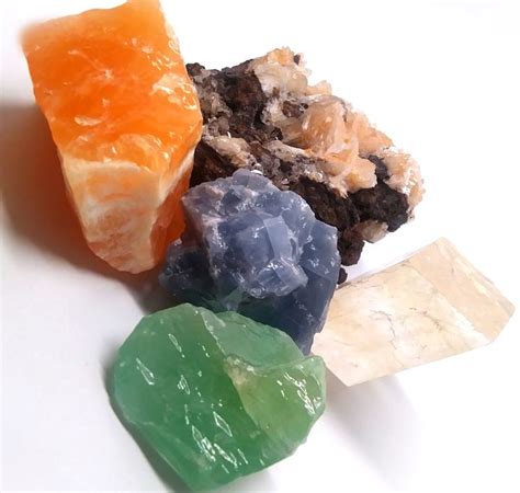 Calcite forms in many different types. Here, we have Orange Calcite, Blue Calcite, Emerald ...