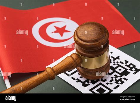 Judge gavel, barcode sheet and Tunisian flag, administrative punishment concept for violation of ...