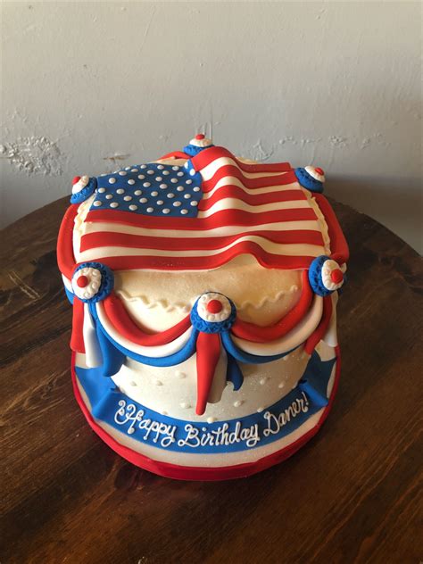 a birthday cake decorated with an american flag