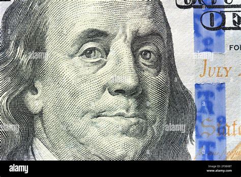 Close up of Benjamin Franklin face on 100 US dollar bill Stock Photo ...