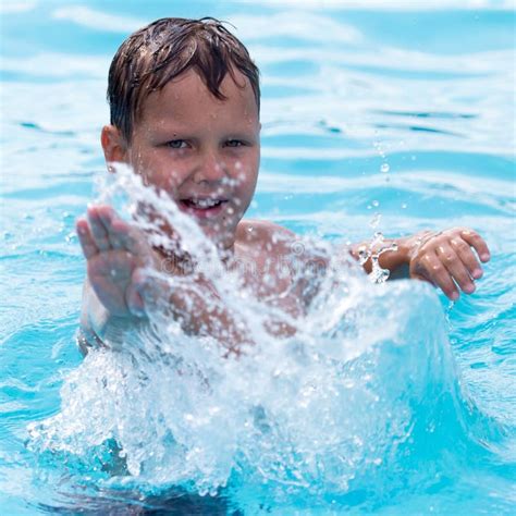 The Boy Is Swimming In The Pool Stock Photo - Image of water, blue ...