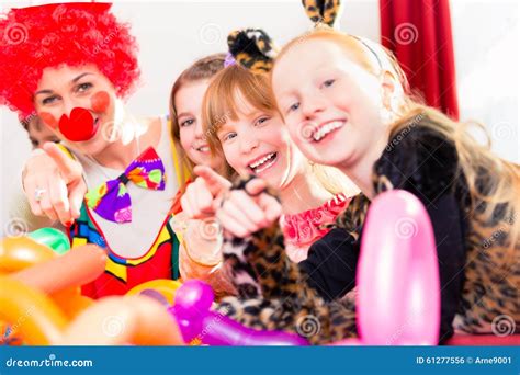 Clown at Children Birthday Party with Kids Stock Photo - Image of celebration, hats: 61277556