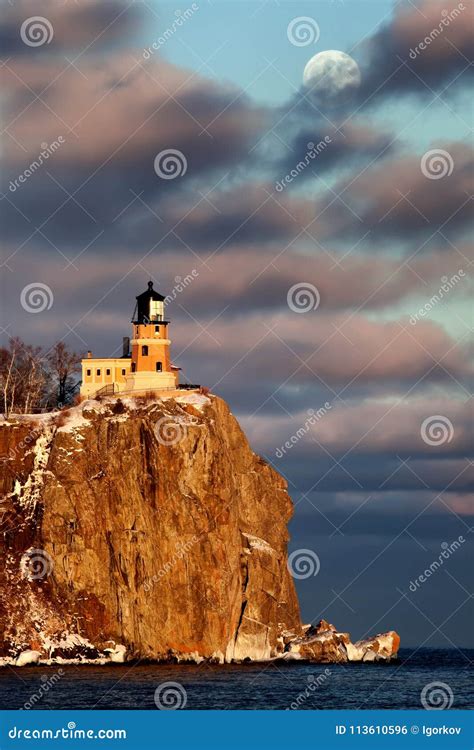 Split Rock Lighthouse in Winter Stock Photo - Image of lake, clouds ...