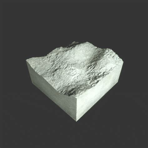 a white rock sitting on top of a black surface