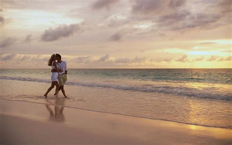 Lovely couple walking along the sea on the beach wallpaper ~ The Wallpaper Database