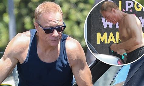 Jean-Claude Van Damme shows off his muscled physique as he changes in the street after workout ...