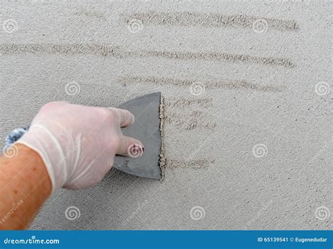 Plastering using a trowel stock image. Image of floor - 65139541