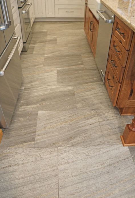 This gorgeous flooring is luxury vinyl tile! It looks exactly like a tile floor. EXCEPT it is ...