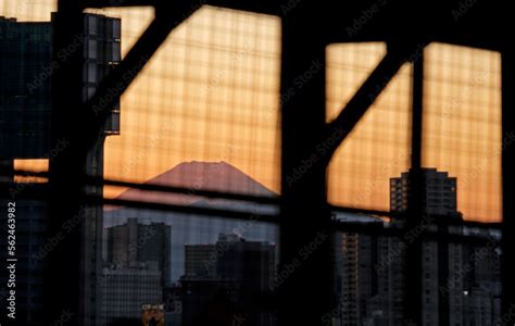 Mount Fuji during sunset seen between buildings in Tokyo, Japan Stock ...