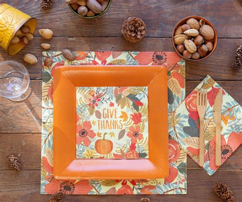 Paper plates and napkins for a stylish Thanksgiving tablescape. The use of paper plates on ...