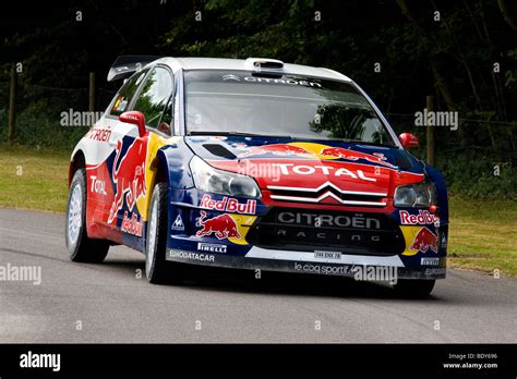 2009 Citroen C4 WRC on the hillclimb at Goodwood Festival of Speed, Sussex, UK. Driver ...