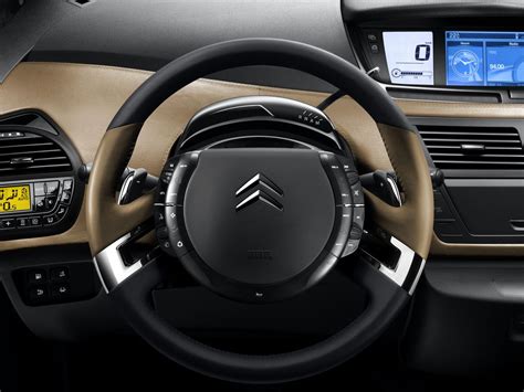 the interior of a car with an electronic display and steering wheel ...