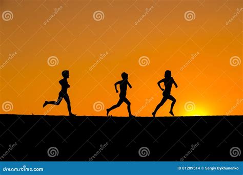 Silhouette of Kids Running Against Sunset Stock Photo - Image of ...