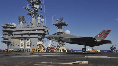 Navy's newest fighter makes first carrier landing | CNN