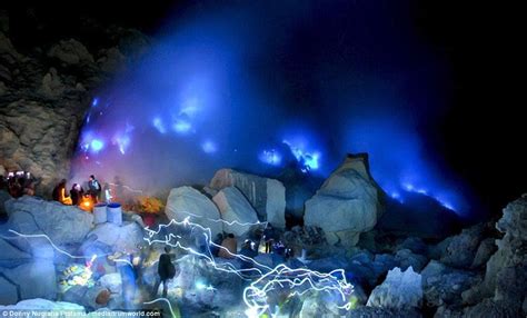 Stunning photos show a BLUE volcano lighting up the skies of Indonesia | Daily Mail Online