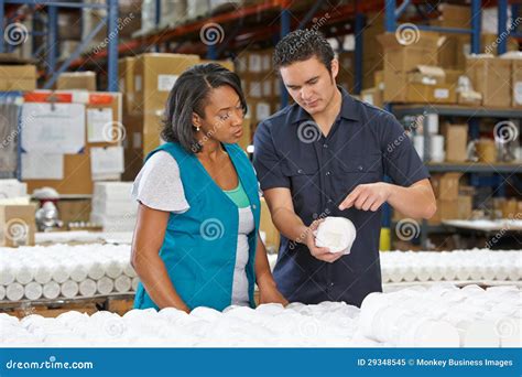 Factory Worker Training Colleague On Production Line Stock Image ...