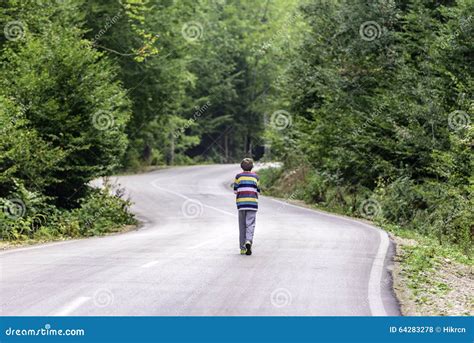 Little Boy Walking Alone on the Road in Forest Stock Photo - Image of dream, forlorn: 64283278