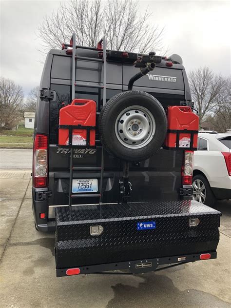 Storage, spare tire carrier, extra fuel storage, and double bike rack. | Van life diy, Fuel ...