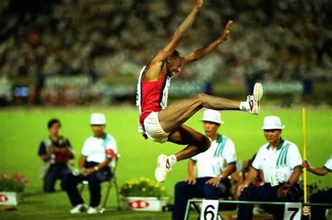 Mike Powell breaks the long jump World Record Our beautiful Wall Art ...