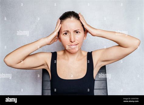 A woman having headache, exercises to beat headache Stock Photo - Alamy