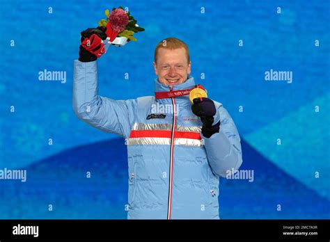 Gold medal winner Norway's Johannes Thingnes Boe poses during a medal ceremony for the men's 10 ...