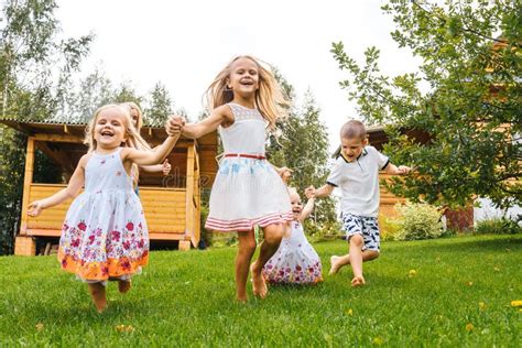 Little Girls Having Fun on Grass Stock Photo - Image of care, nature: 196928670