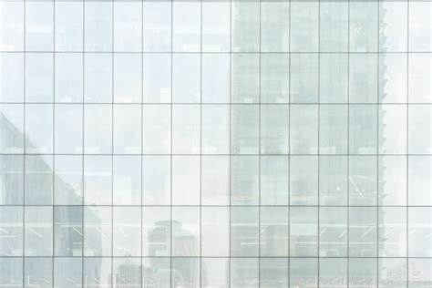 Premium Photo | Facade of a glass building - futurist background.