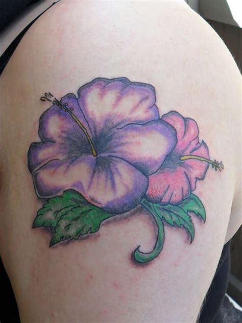 Purple-ink hawaiian hibiscus flower tattoo on upper arm - Tattooimages.biz