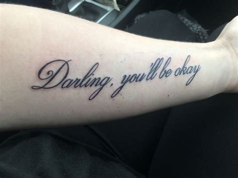 a person with a tattoo on their arm that says, daring you'll be okay