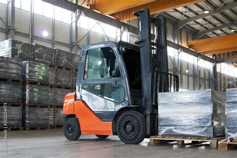 Working Forklift in warehouse. Forklift loader pallet stacker truck ...