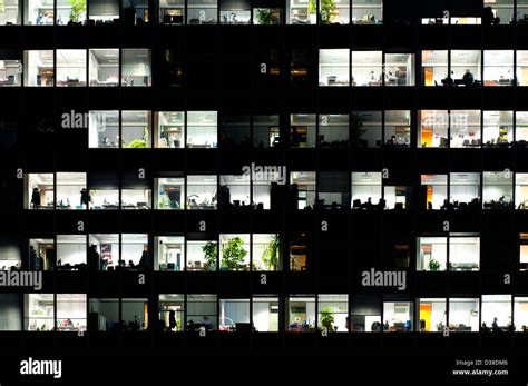 Windows in an office building at night Stock Photo - Alamy