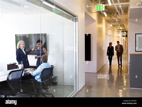 Business people talking in office Stock Photo - Alamy