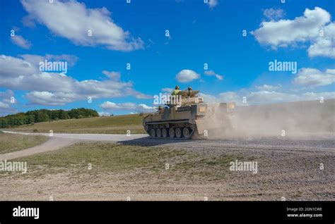 British army Warrior FV510 light infantry fighting vehicle tank in action on a military exercise ...