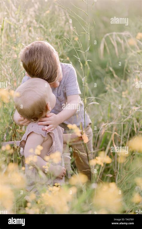 Brother sister hug hi-res stock photography and images - Alamy