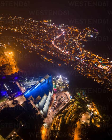 Aerial view of our Lady of Lebanon Basilica and statue illuminated at ...