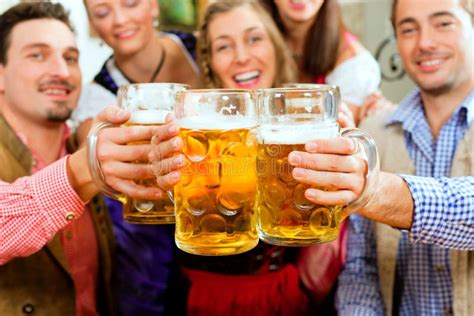 People Drinking Beer in Bavarian Pub Stock Photo - Image of bavaria, celebration: 16977378