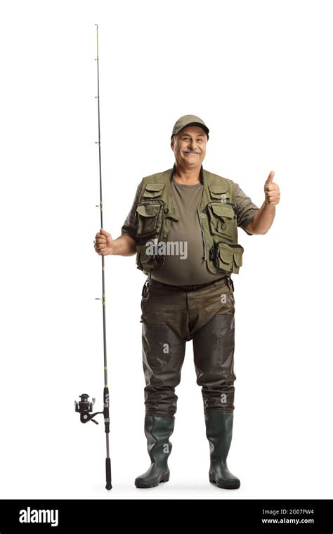 Full length portrait of a fisherman in a uniform standing with a ...