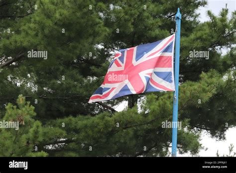 Union jack flying in the wind Stock Photo - Alamy