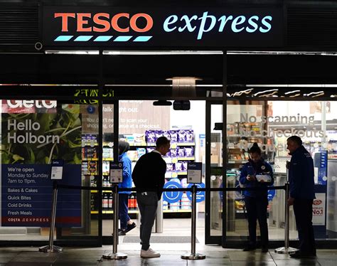 Tesco launches checkout-free stores where you can walk out and pay by app | National