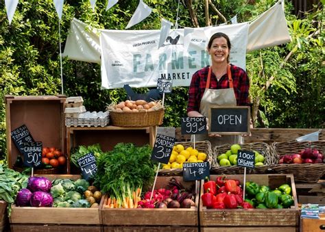 Premium Photo | Greengrocer selling organic fresh agricultural product at farmer market