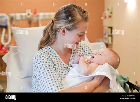 Young mother holding her newborn baby at hospital Stock Photo: 41724119 - Alamy