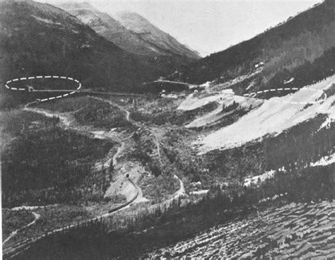 Retouched photograph shows location of two spirals. Westbound train is ...