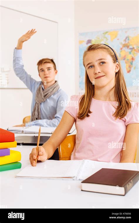 Happy students in the classroom Stock Photo - Alamy