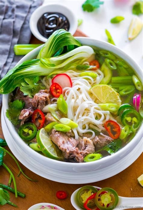 Pho, Vietnamese Noodle Soup with signature rich, meaty, and savory broth loaded with fresh ...