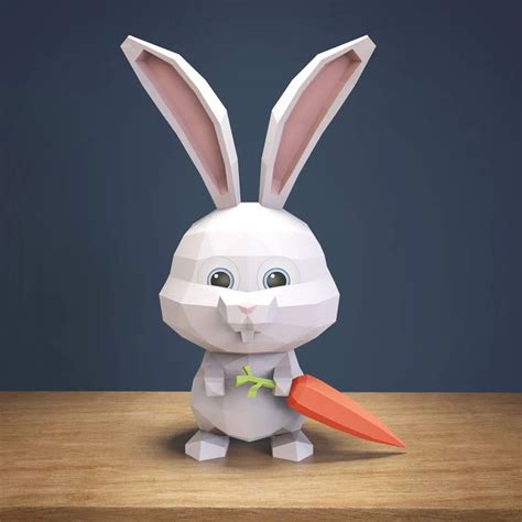 an origami rabbit holding a carrot on a table