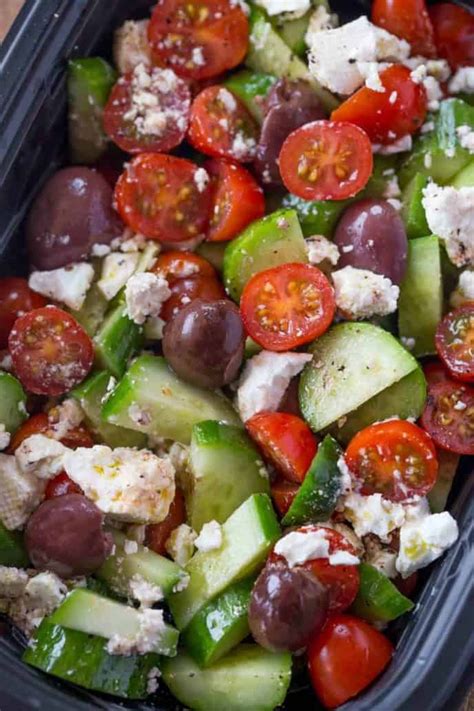 Easy Greek Salad with cucumbers, grape tomatoes, feta cheese and kalamata olives with a lemony ...