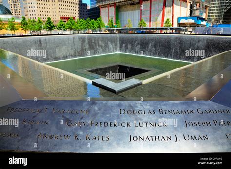 9/11 memorial at ground zero, waterfalls with names inscribed around ...