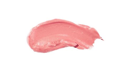 Premium Photo | A swatch of pink lip gloss with a white background.