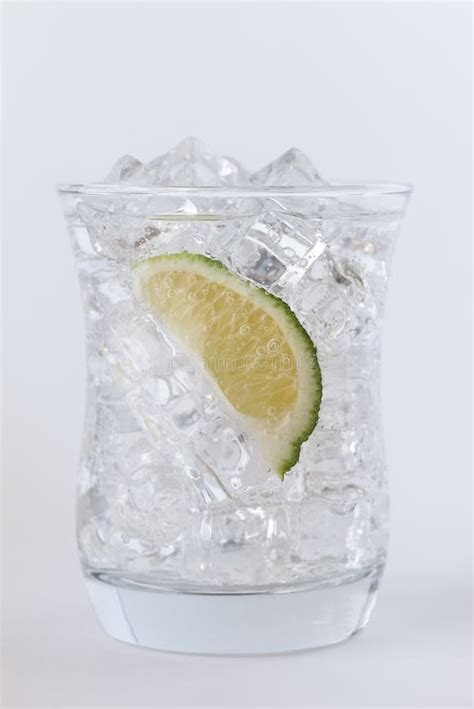 A Lime Wedge in a Glass of Tonic Water Stock Image - Image of summer, clear: 113489343